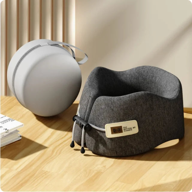 Dark gray U-shaped neck support travel pillow with a washable cover, offering superior comfort and a sophisticated travel accessory style