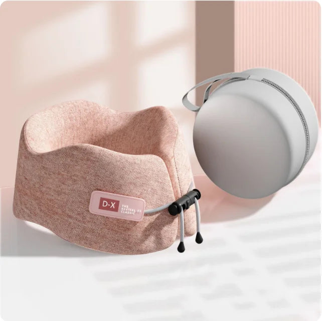Soft pink U-shaped travel pillow designed with ergonomic memory foam for optimal neck support, ideal for stylish jet-setters.