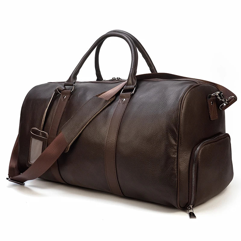 Classic brown leather travel duffel bag, 55cm, offering a timeless design, roomy compartments, and comfortable carrying options for travelers.