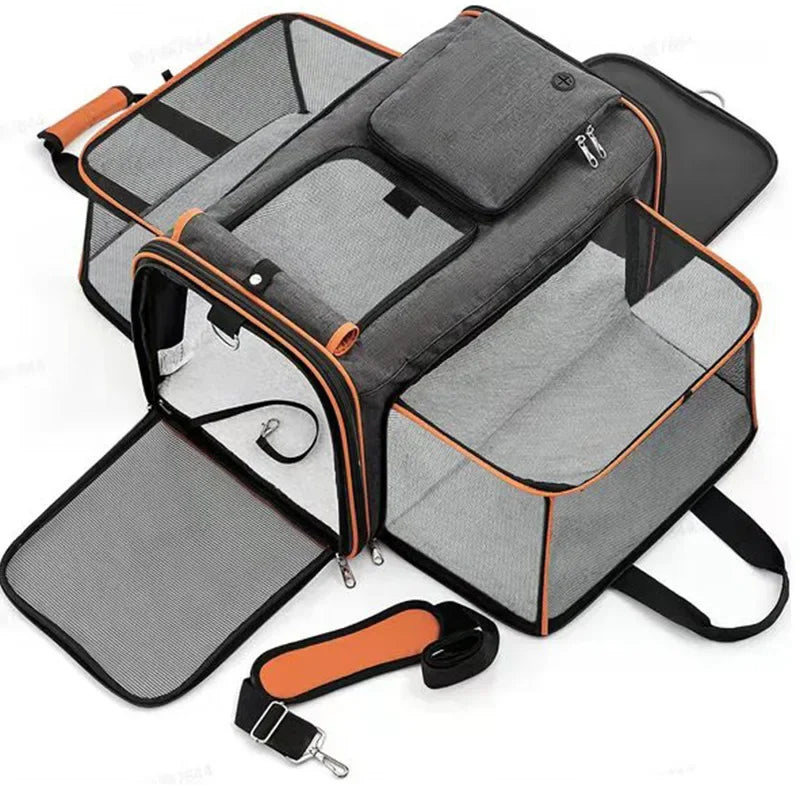 A top view of the expandable pet carrier showing its ventilation panels and expanded comfort zones. The image emphasizes its travel-friendly design.