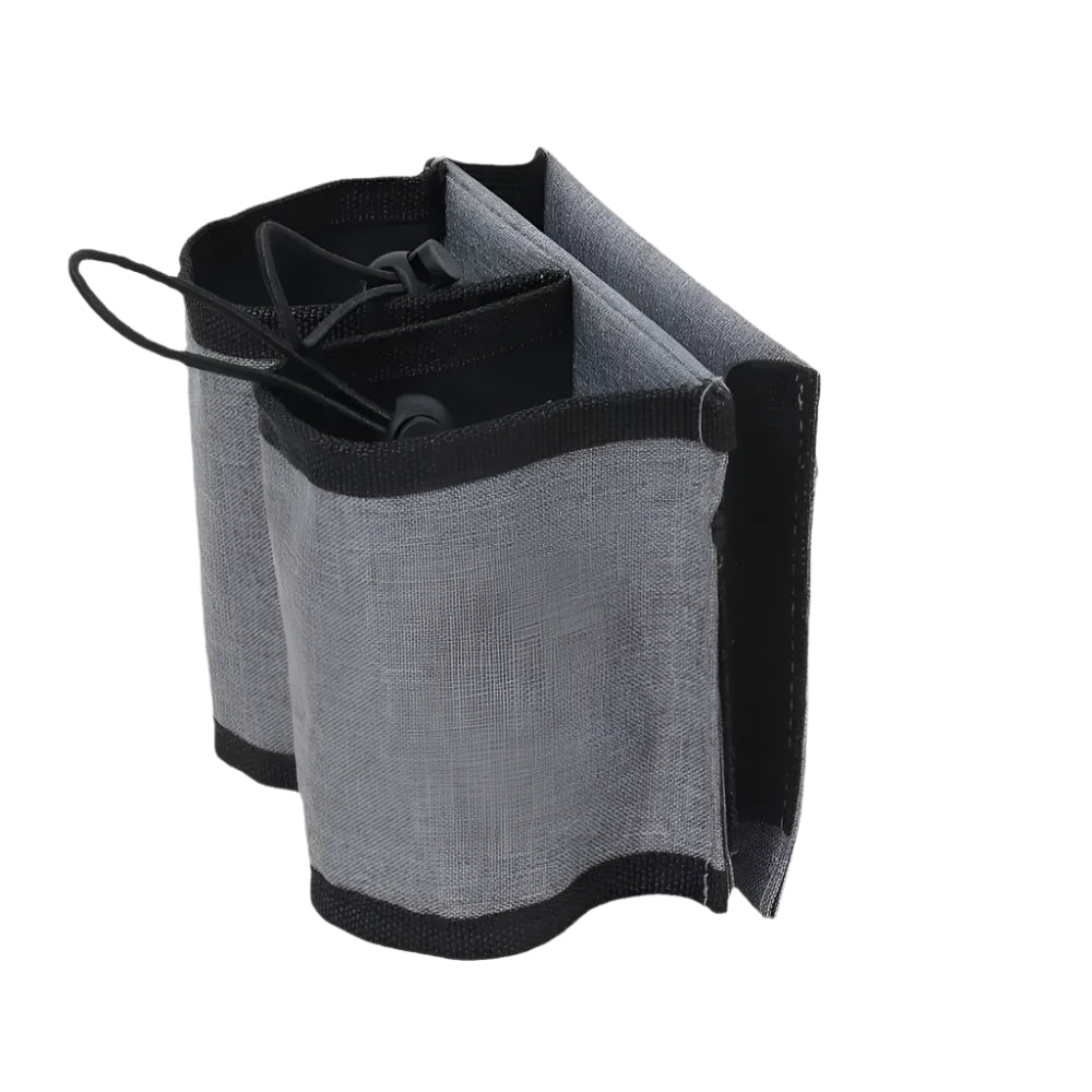 Compact, folded view of the travel luggage cup holder, showcasing its portability.