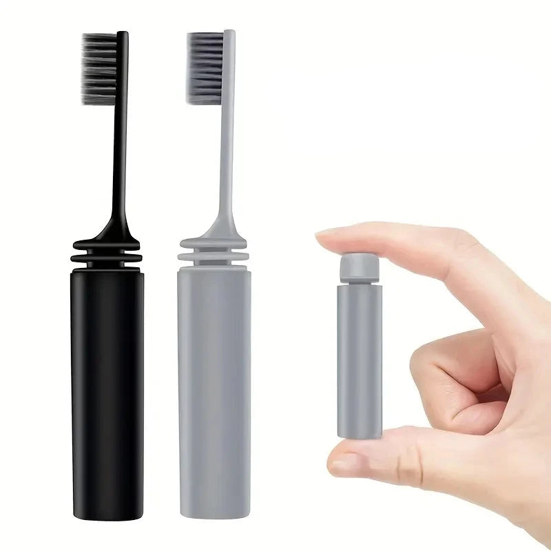 A folding toothbrush in its compact, folded position. The design highlights portability and hygiene protection.