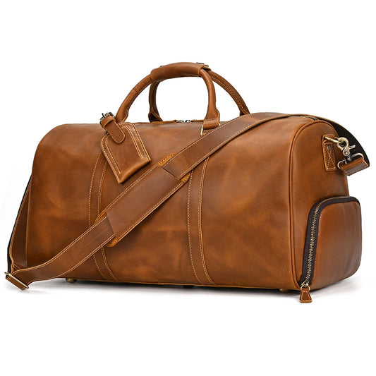 Light brown leather travel duffel bag, 55cm, featuring spacious compartments, high-quality leather construction, and an adjustable carrying strap for versatile travel.