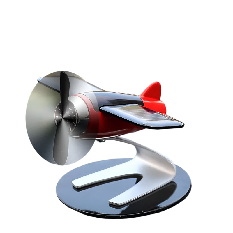 Front view of a solar-powered airplane ornament with a sleek silver base and a rotating propeller in motion, showcasing its dynamic solar-powered feature and polished design.