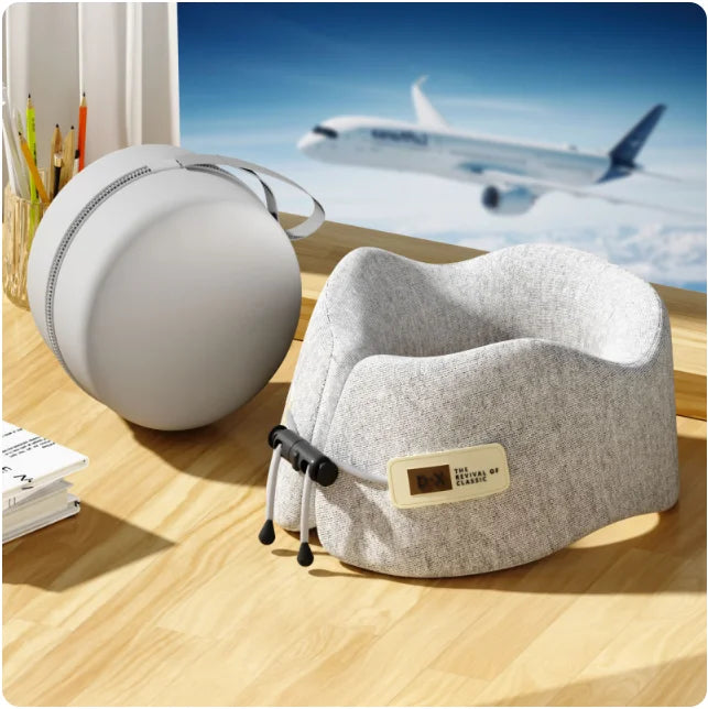 Compact U-shaped pillow travel set, shown in its packaging with a convenient carrying pouch, perfect for easy portability.