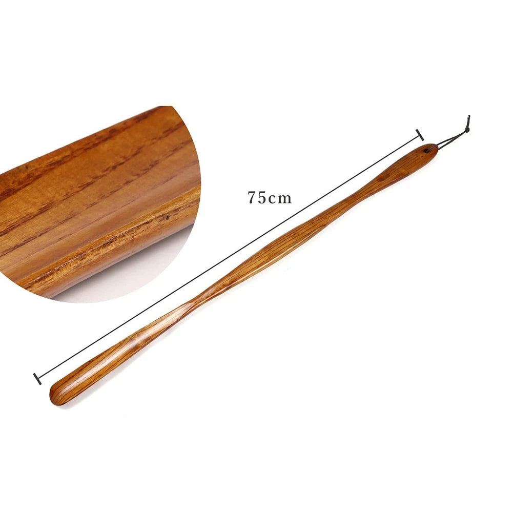 Side profile of the long wooden shoehorn showcasing its sleek, durable design.